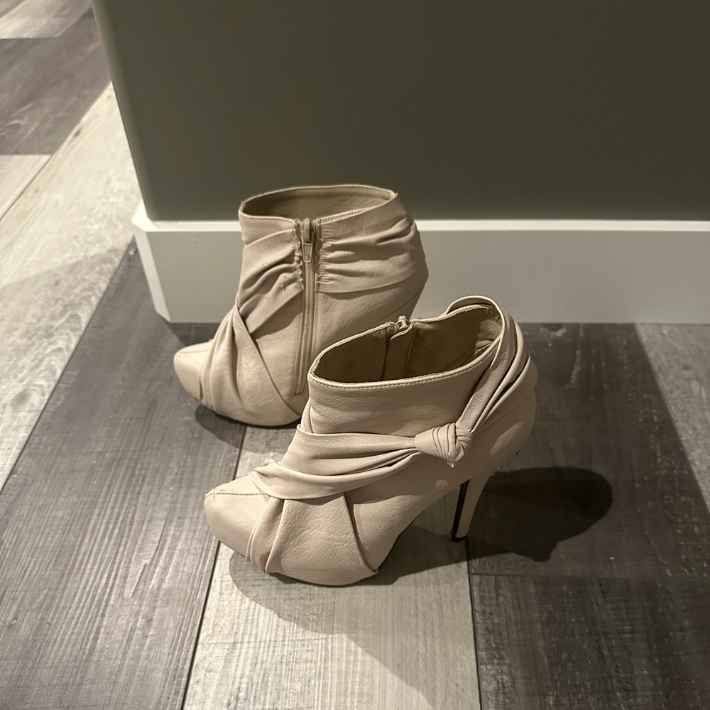 Cream 3 inch heel booties. Size 6. A few scuffs. Zippers work perfectly.